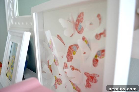 Framed Spoonflower fabric, repurposed from Ikea butterfly artwork.