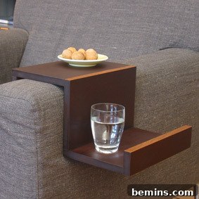 A glass of water is on the wooden piece. DIY Sofa Hanger Example
