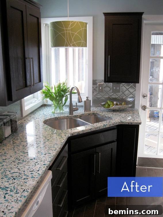After Kitchen Remodel: Stunning transformation with recycled glass countertops and updated cabinets.