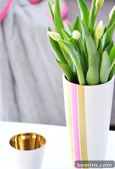 Glass vase decorated with colorful washi tape