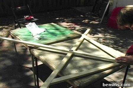 Adding cross bracing to the wooden frame