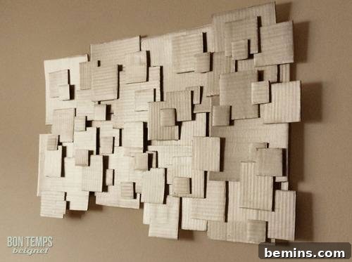 Reimagine Your Walls: 10 Upcycled DIY Art Projects 3 " A paper card board wall art displayed on a wall "