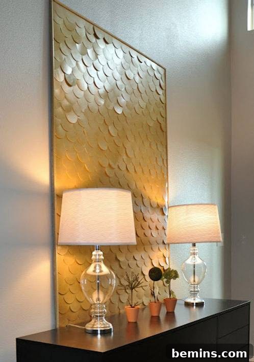 Reimagine Your Walls: 10 Upcycled DIY Art Projects 6 A large gold painting with two lamps in front on a desk.