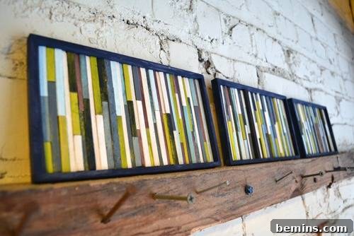 Reimagine Your Walls: 10 Upcycled DIY Art Projects 8 Group of rectangular picture frames with rectangles painted on inside on top of wood shelf.