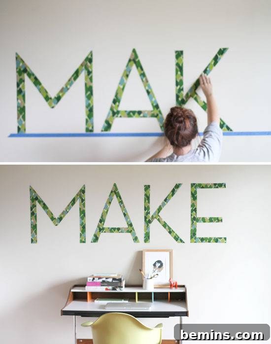Woman preparing typography art on wall.