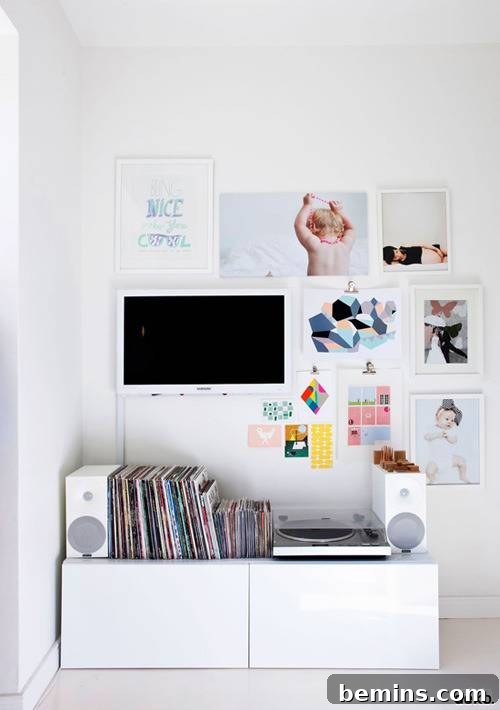 A serene white room is elevated by the addition of a stunning gallery wall, adding a touch of personality and artistic flair to the minimalist space.