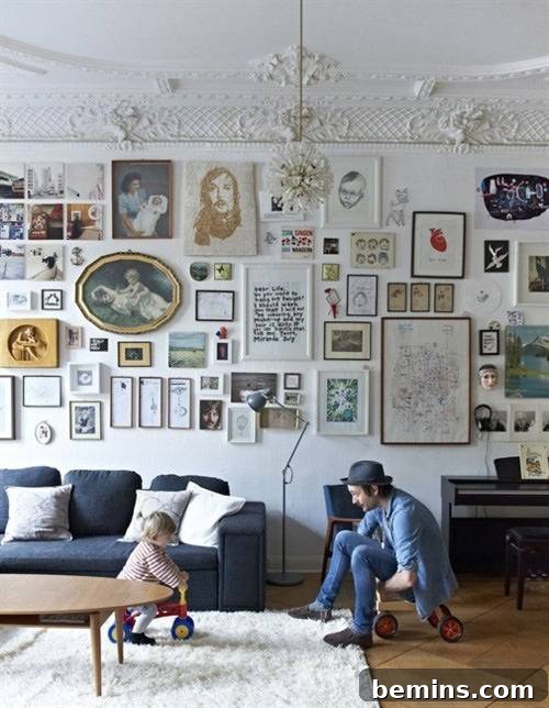 A living room wall is completely transformed into a captivating visual display, adorned with a multitude of wall art pieces that create a striking and personalized statement.