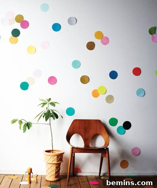 DIY Wall Decor: 10 Vibrant Art Projects to Personalize Your Space 8 A white wall covered in colorful confetti dots, creating a festive and playful atmosphere.