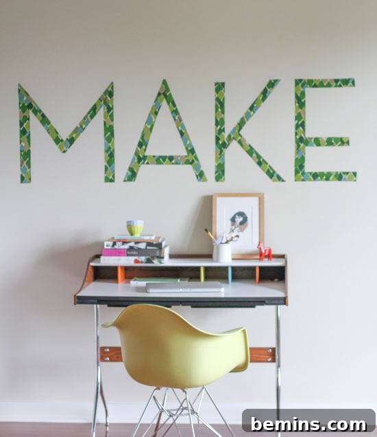 DIY Wall Decor: 10 Vibrant Art Projects to Personalize Your Space 9 A crafting table with a yellow chair and a DIY typography wall art piece using fabric.