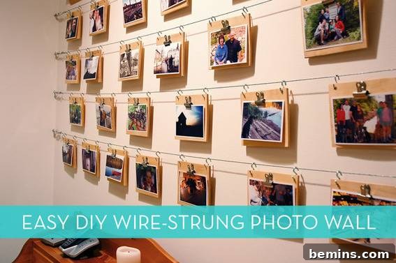 Several pictures hanging from a wire strung across a wall, creating a simple and minimalist photo display.