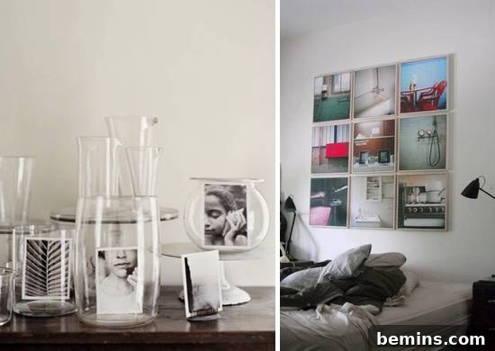 A framed picture hanging on a white wall next to a lamp, showcasing an alternative and modern approach to traditional framing.
