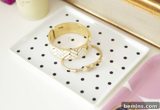 20 Heartfelt DIY Gifts for Mom 12 Two jewelry items on a white plate.