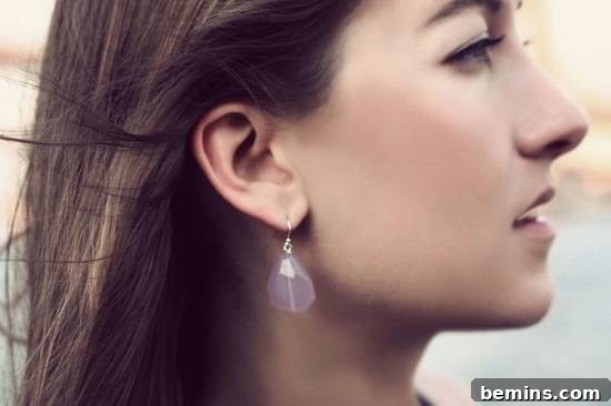 20 Heartfelt DIY Gifts for Mom 18 Woman facing sideways with a translucent earring.