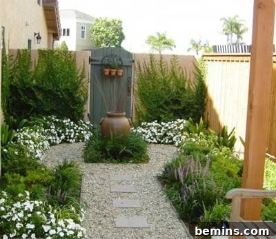 A backyard courtyard showcases planned landscaping with gravel rocks, low-growing shrubs, and vines, creating a harmonious garden.