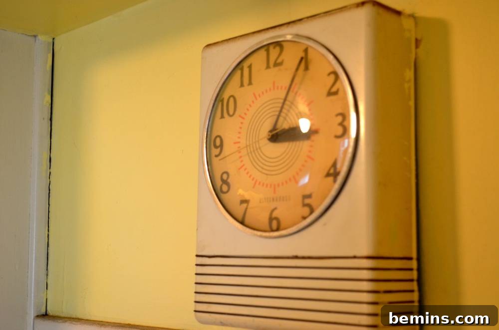An old analog clock on the wall.