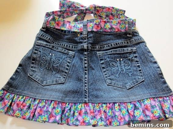 A homemade women's mini skirt is made of denim and lace.