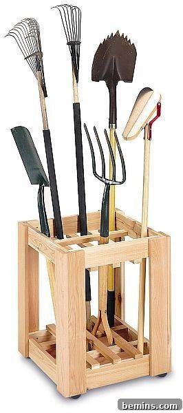 Garage Makeover: 10 DIY Organization Hacks 11 A wooden container holding various garden tools.