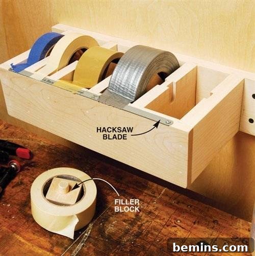 Garage Makeover: 10 DIY Organization Hacks 3 Wall-mounted wooden shelf designed to hold tape rolls.
