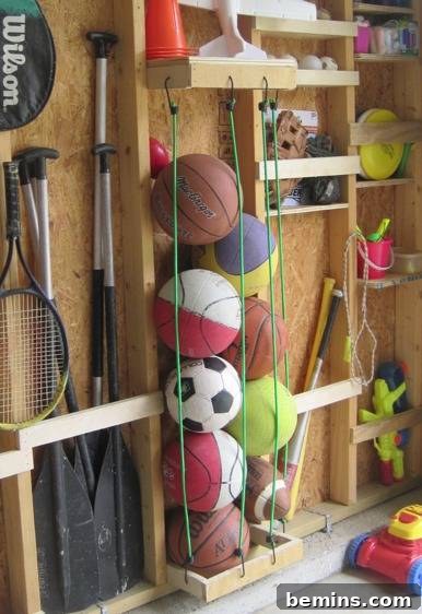 Garage Makeover: 10 DIY Organization Hacks 8 Sports balls organized in a garage with vertical bungee cords.