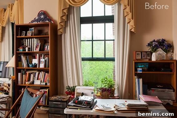A senior living room interior with bookshelves and a white table near a green window, designed to promote a sense of calm and well-being.