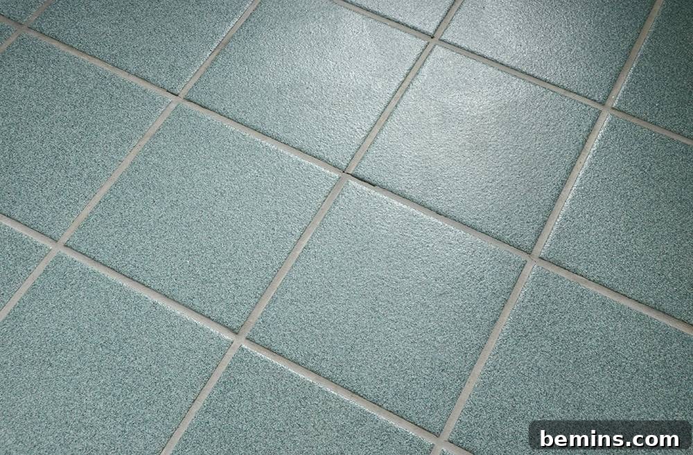 Tile cleaned with OxiClean, emphasizing the effectiveness of the cleaning solution.