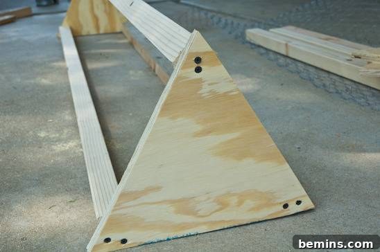 Attach the triangle pieces to the lumber.