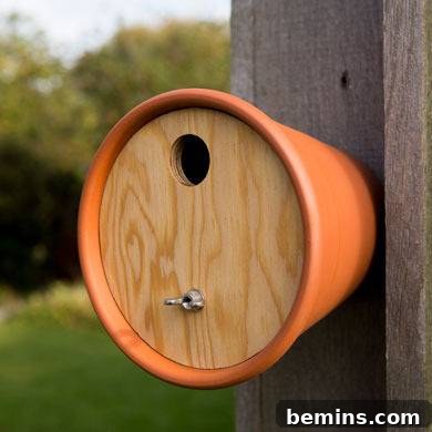 6 Sensational Upcycled Birdhouses
Six Stunning Upcycled Bird Abodes 5 A simple pot birdhouse with a wooden roof hanging from a wooden pole.