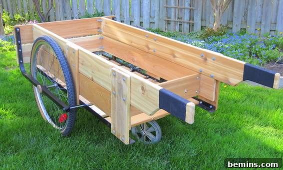 Homemade wooden wheel barrow outside on the grass