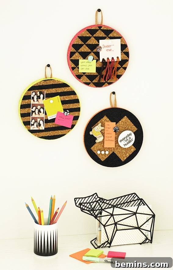 An illustration of three circular haning memo boards with pencils and a bear figurine below.