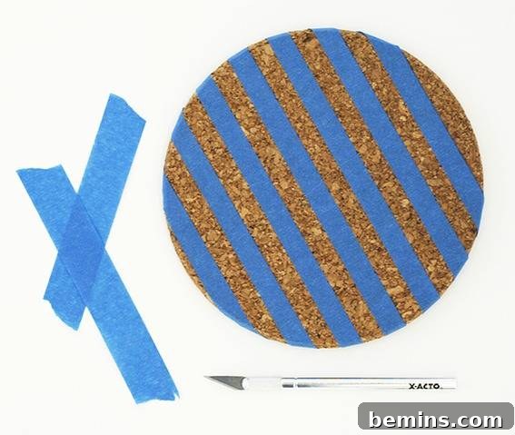 Blue tape is striped on a cork board.