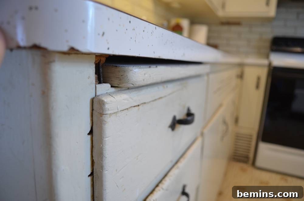 Before: Close-up of the old cabinet drawers with outdated hardware.