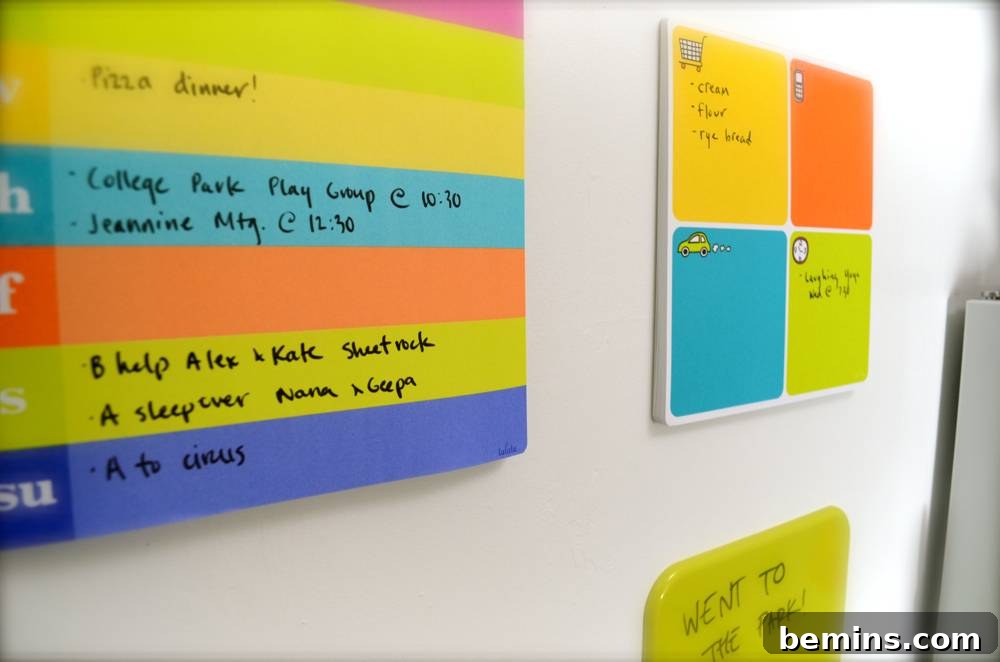 Colorful bulletin boards hanging on a white wall.