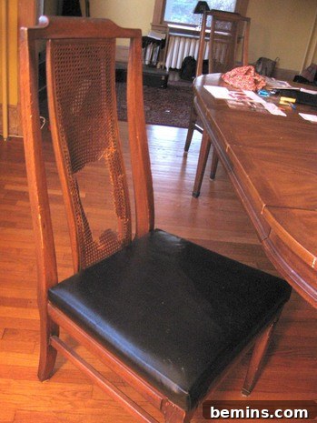 Close-up of the broken caning on one of the dining chairs.