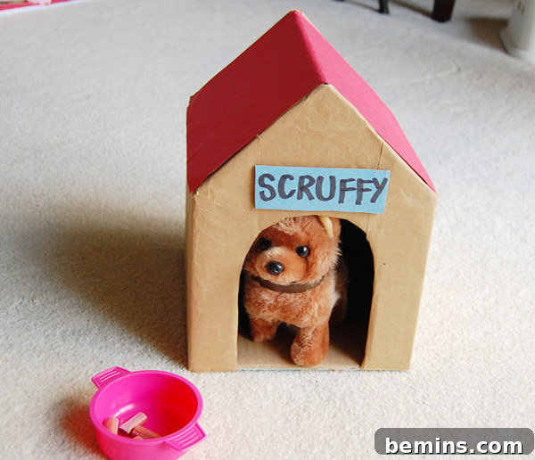 Cardboard Creations: 12 DIY Play Projects for Kids 9 A small, charming cardboard doghouse with a red roof and a toy dog inside.