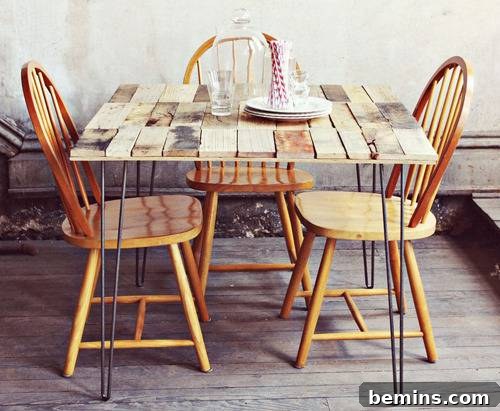A rustic wood pallet table with modern hairpin legs, surrounded by wooden chairs.