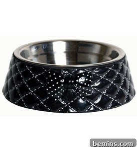 7 Chic Pet Bowls That Elevate Mealtime 7 A black pet food bowl with a stylish silver metal interior.