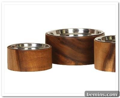 7 Chic Pet Bowls That Elevate Mealtime 8 Three stylish silver bowls in beautifully crafted wooden holders.