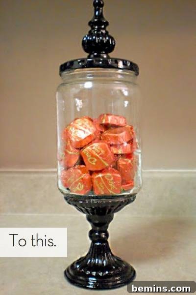 A glass container filled with vibrant orange candy.