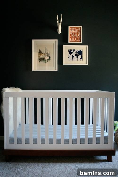White crib near mallard green wall with wall art