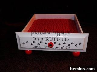A furniture drawer transformed into a comfortable and inviting dog bed, demonstrating a simple and effective DIY project.