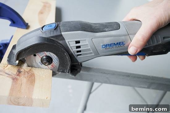 A person using a cutter with a piece of wood.