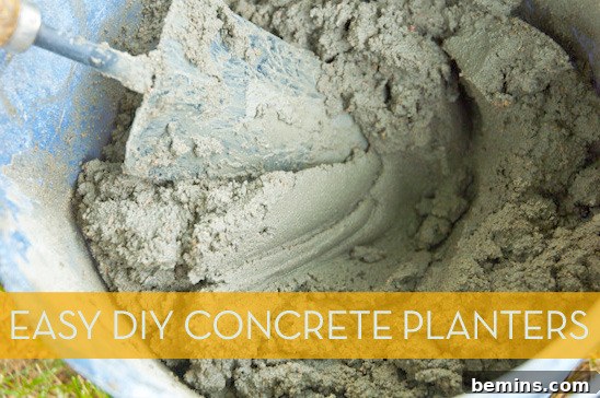 Metal trowel mixing concrete in plastic bucket.
