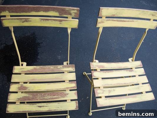 Two old yellow slat chairs. Ready for sanding and a fresh coat of paint.