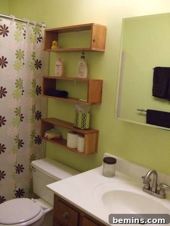 Bathroom design with a washbasin and wooden rack for storing bathroom essentials.
