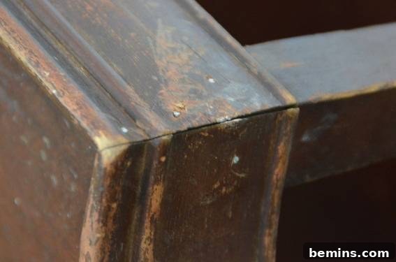 Close-up of the wooden beams of the coffee table, showcasing its aged and imperfect texture