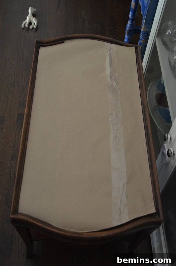 A finished brown bench with a tan cover, showcasing the desired upholstered look