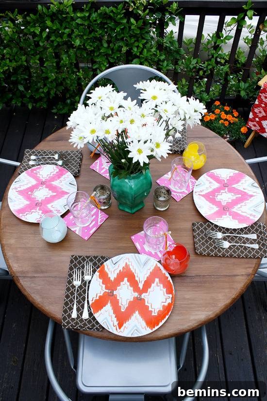 10 DIY Projects to Elevate Your Outdoor Dinner Party 11 A decorated outdoor table setting with Ikat patterned plates.