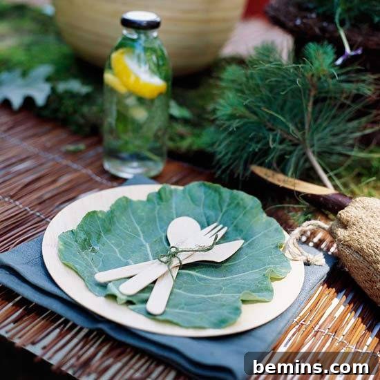 10 DIY Projects to Elevate Your Outdoor Dinner Party 5 A white plate with silverware placed on a large, decorative cabbage leaf.