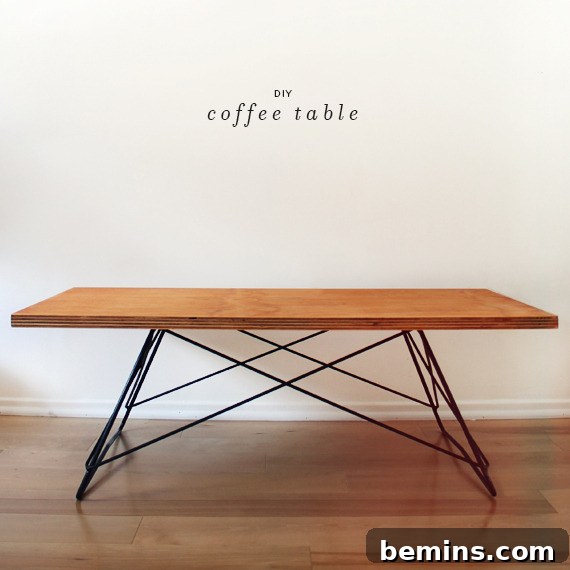 Wood dining table with metal wire legs on top of a wood floor.