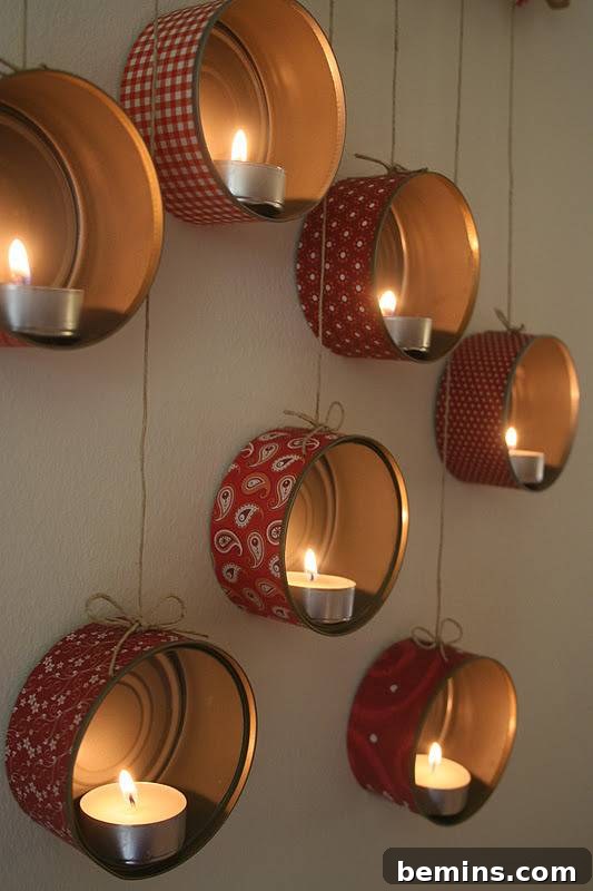 Beautifully decorated short metal cans, transformed into mood lighting with fabric coverings and tea candle lights, create an inviting glow on a wall.